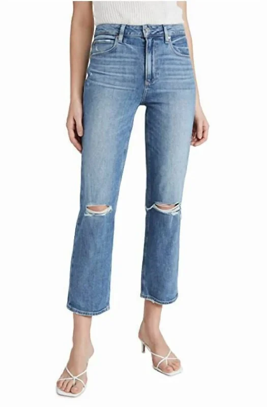 Dark wash jeans with whiskering and fading at the thighsSarah Solera Destructed Wash High Rise Crop Jeans In Blue