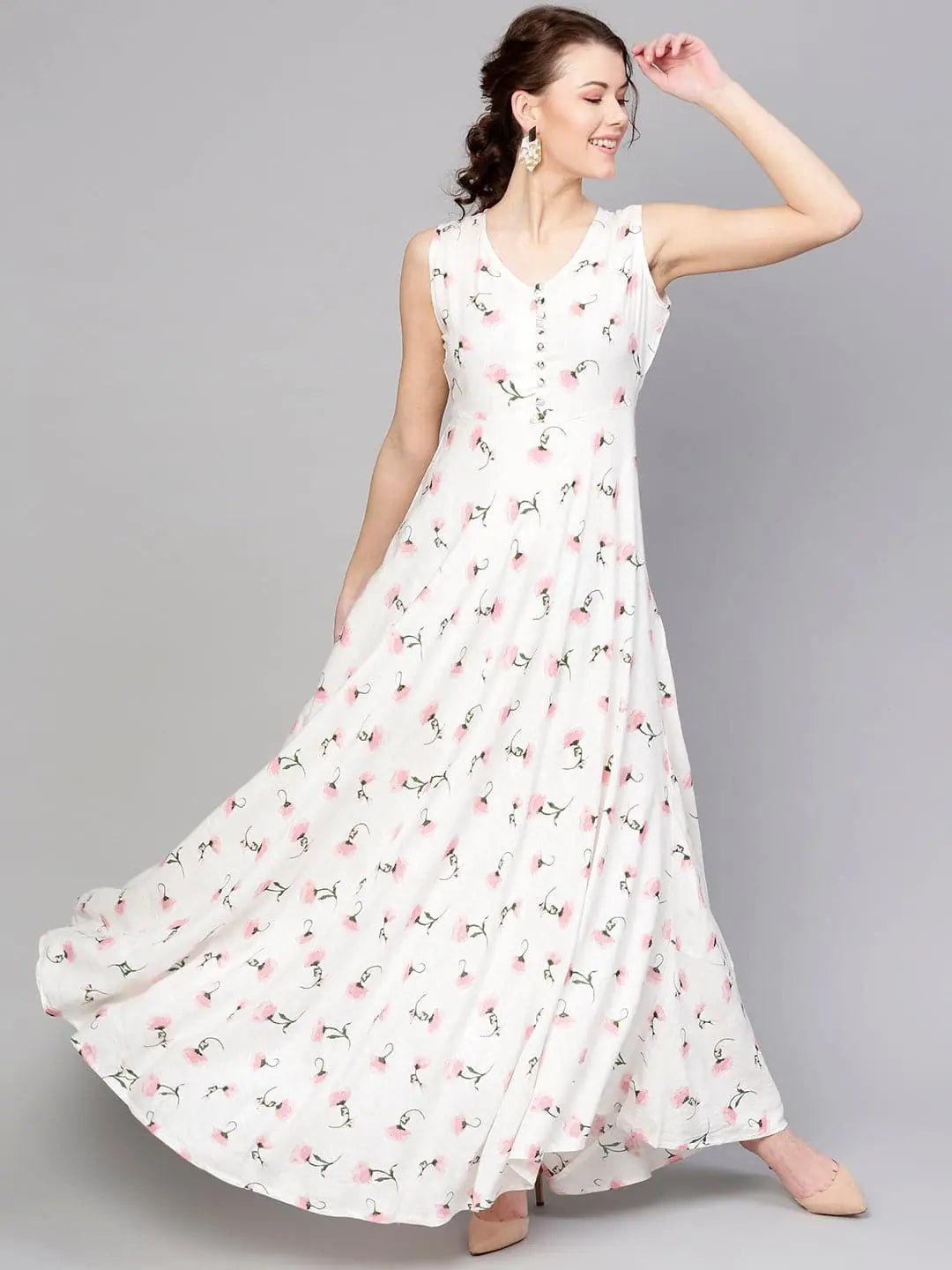 Statement dresses for making a fashion statementWhite Floral Sleeveless Flared Maxi