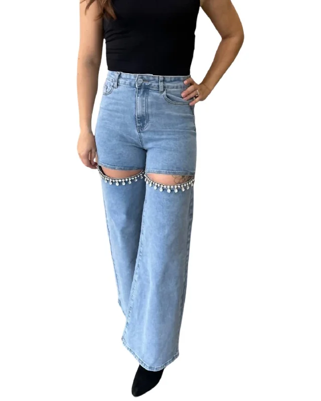 Jeans with distressing at the thighsMid Rise Crystal Slit Knee Jeans In Light Wash