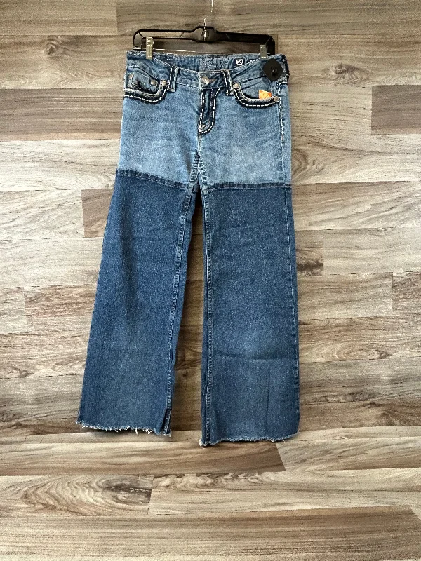 Skinny jeans with rips and tears for an edgy lookJeans Boot Cut By Miss Me In Blue Denim, Size: 8