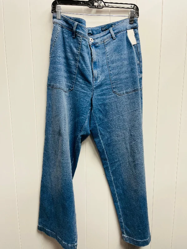 Jeans with a distressed and bleached finish for a unique and casual appearanceJeans Wide Leg By J. Jill In Blue Denim, Size: 14