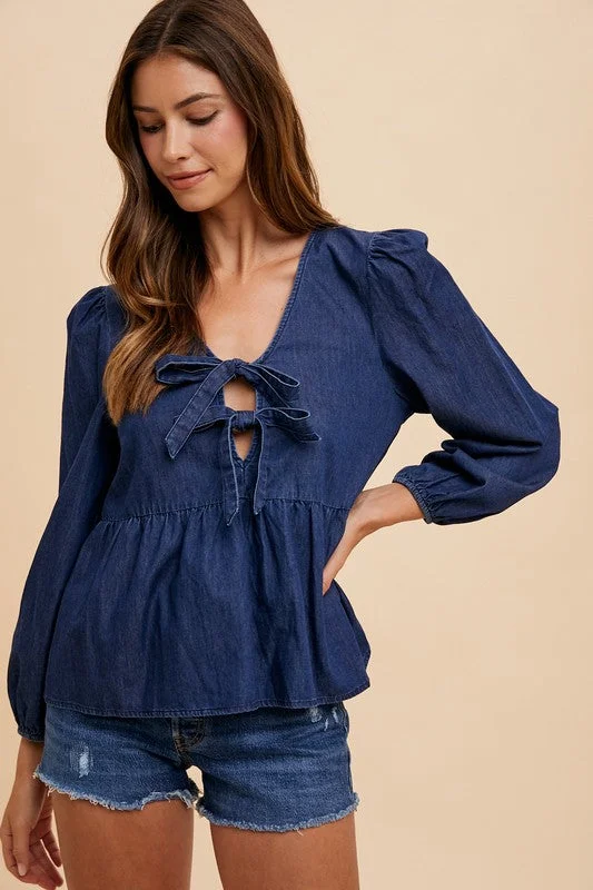 Jeans with a distressed and repaired look for character and charmAnnie Wear Tie Front Peplum Long Sleeve Denim Top