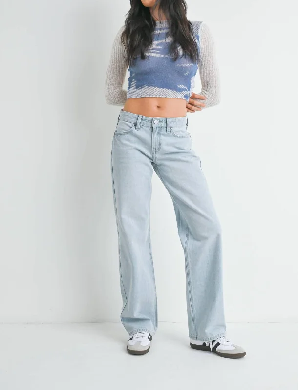 Distressed jeans with bleach spots for a unique appearanceLow Rise Relaxed Straight Jean In Light Denim