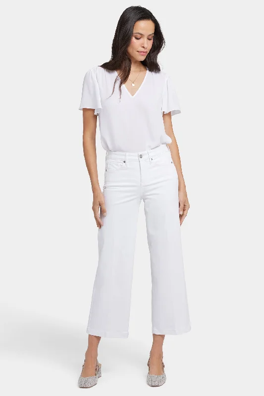 Stretch denim jeans with a low rise and fitted legs for a modern lookTeresa Wide Leg Ankle Jeans In Petite - Optic White